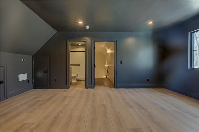 789 Old Mill Ct, Ball Ground, GA 30107 - unfurnished bedroom with wood finished floors, lofted ceiling, connected bathroom, recessed lighting, and baseboards