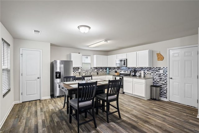 dining room featuring dark hardwood / wood-style floors