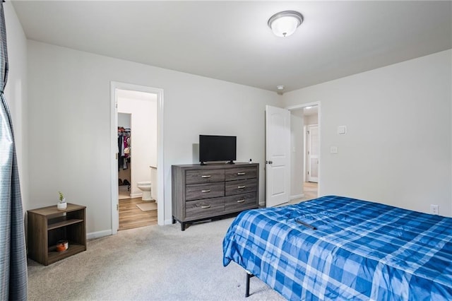 carpeted bedroom with ensuite bathroom