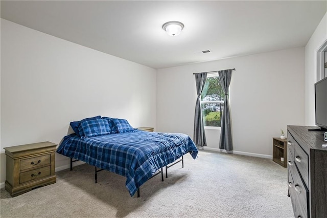 bedroom with light carpet