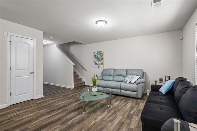 living room with dark hardwood / wood-style flooring