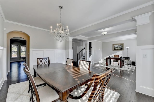 dining room with a chandelier, dark hardwood / wood-style floors, and ornamental molding