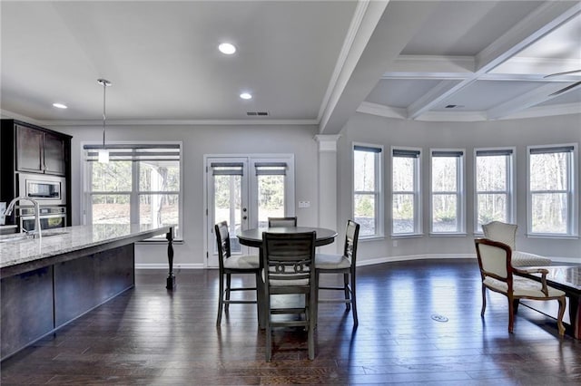 dining space with dark wood-type flooring, crown molding, sink, ceiling fan, and beamed ceiling