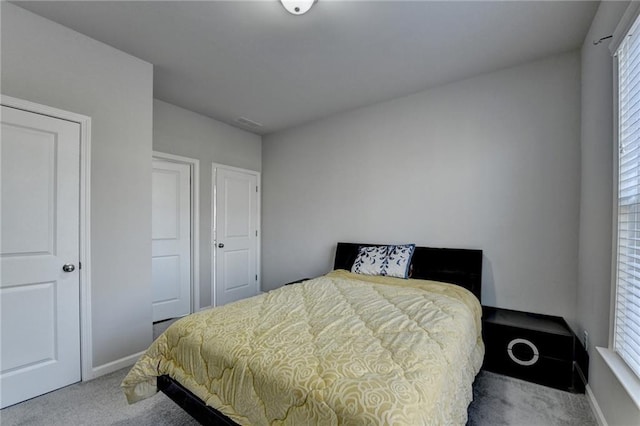 bedroom with light carpet