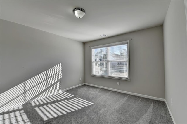 empty room featuring carpet flooring