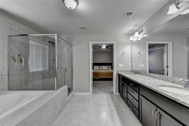 bathroom with tile patterned flooring, vanity, and plus walk in shower