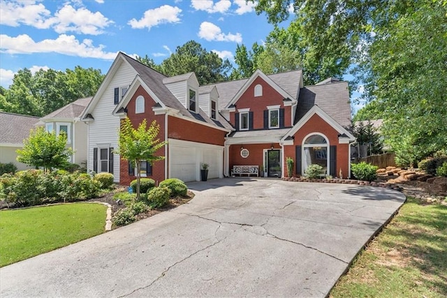 view of front property with a garage and a front yard