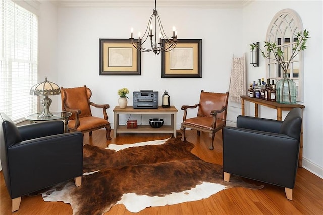730 Midway Ave, Canton, GA 30114 - sitting room with wood finished floors, a chandelier, and ornamental molding