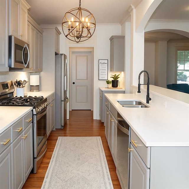 730 Midway Ave, Canton, GA 30114 - kitchen with appliances with stainless steel finishes, gray cabinets, arched walkways, wood finished floors, and a chandelier