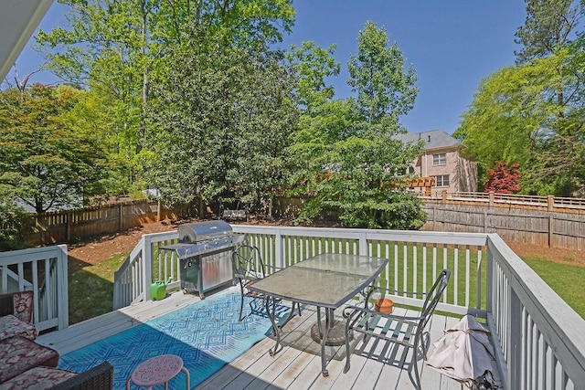 2775 Whippoorwill Cir, Duluth, GA 30097 - deck with area for grilling, outdoor dining area, and a fenced backyard