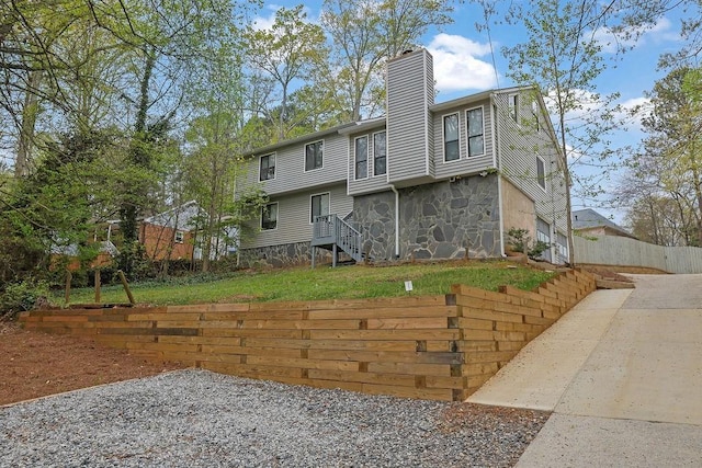 2775 Whippoorwill Cir, Duluth, GA 30097 - rear view of property featuring a chimney and stone siding