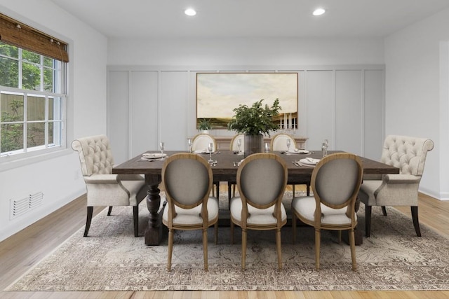 3981 Longview Dr, Chamblee, GA 30341 - dining room featuring a decorative wall, wood finished floors, and recessed lighting