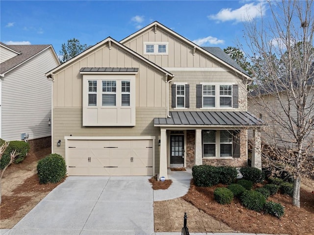 craftsman inspired home featuring metal roof, driveway, a garage, board and batten siding, and a standing seam roof