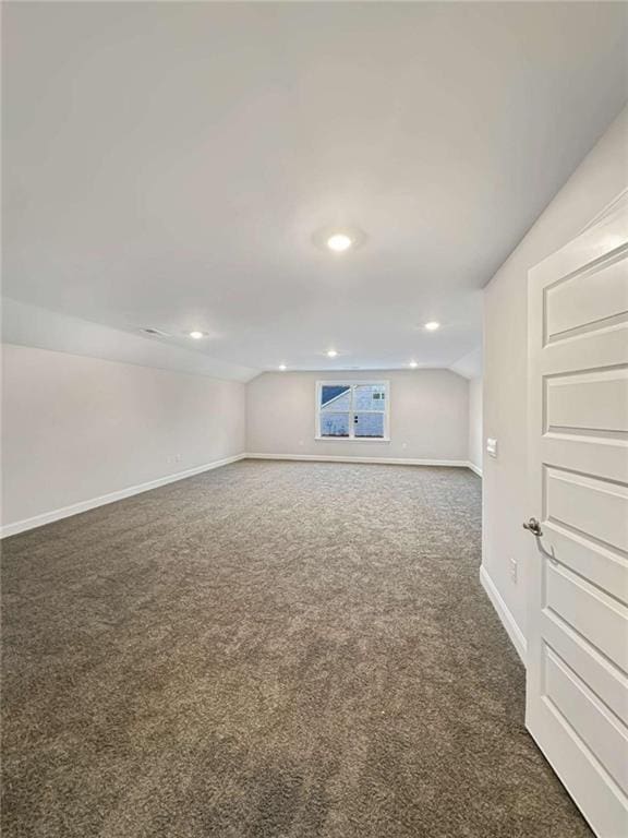 below grade area with carpet, baseboards, and recessed lighting