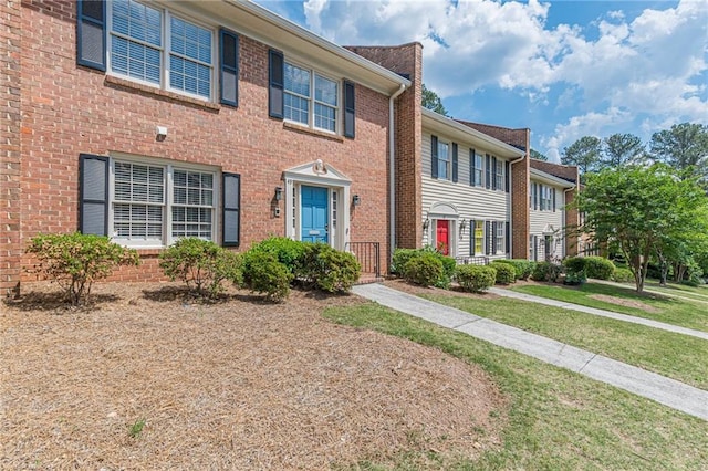 4101 Dunwoody Club Dr Unit 49, Atlanta, GA 30350 - view of front of home with a front lawn and brick siding