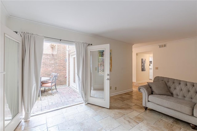 4101 Dunwoody Club Dr Unit 49, Atlanta, GA 30350 - living area with baseboards, visible vents, ornamental molding, and stone tile flooring