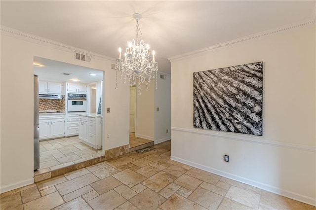 4101 Dunwoody Club Dr Unit 49, Atlanta, GA 30350 - unfurnished dining area featuring crown molding, a notable chandelier, visible vents, and stone tile flooring