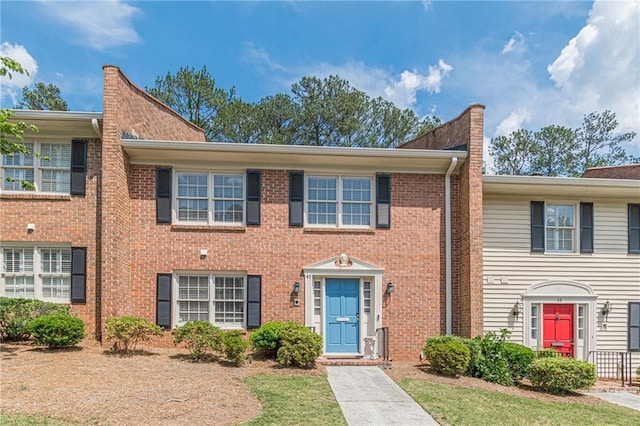4101 Dunwoody Club Dr Unit 49, Atlanta, GA 30350 - townhome / multi-family property featuring a chimney and brick siding