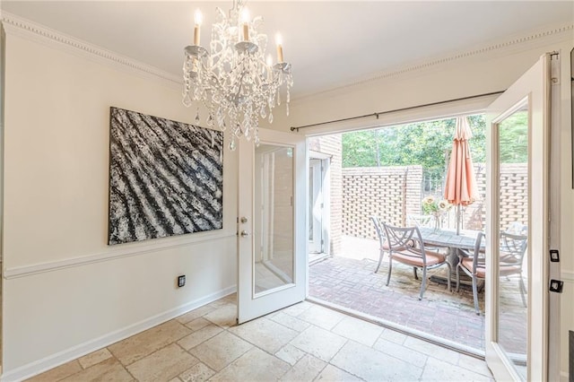 4101 Dunwoody Club Dr Unit 49, Atlanta, GA 30350 - interior space featuring crown molding, baseboards, stone tile floors, and a chandelier