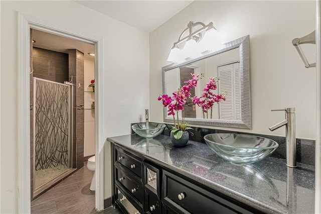 4101 Dunwoody Club Dr Unit 49, Atlanta, GA 30350 - full bath with double vanity, a sink, toilet, and a shower stall