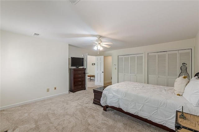 4101 Dunwoody Club Dr Unit 49, Atlanta, GA 30350 - bedroom with visible vents, two closets, baseboards, ceiling fan, and carpet