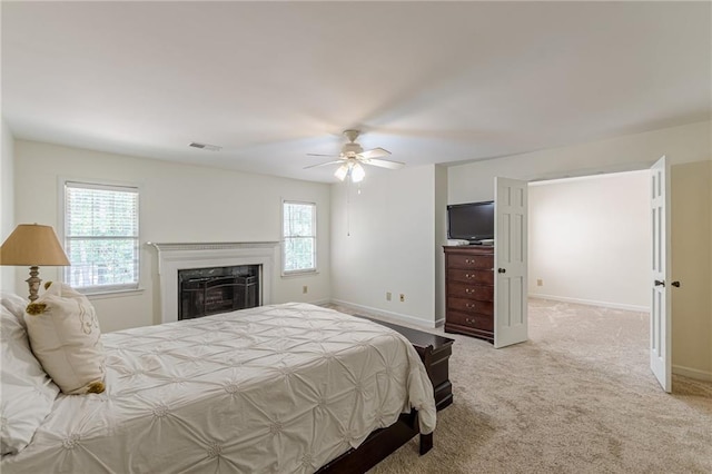 4101 Dunwoody Club Dr Unit 49, Atlanta, GA 30350 - carpeted bedroom with visible vents, a ceiling fan, baseboards, and a premium fireplace