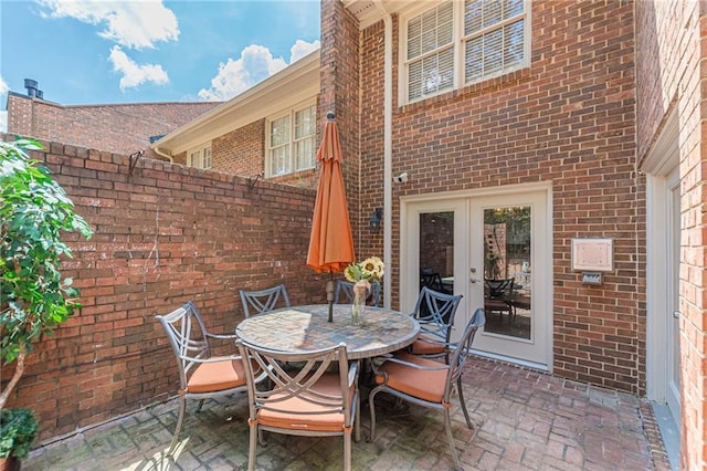4101 Dunwoody Club Dr Unit 49, Atlanta, GA 30350 - view of patio featuring fence, outdoor dining area, and french doors