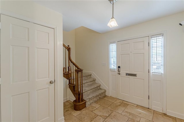 4101 Dunwoody Club Dr Unit 49, Atlanta, GA 30350 - foyer entrance featuring baseboards, stairs, and stone tile flooring