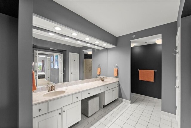 bathroom featuring double vanity and tile patterned floors