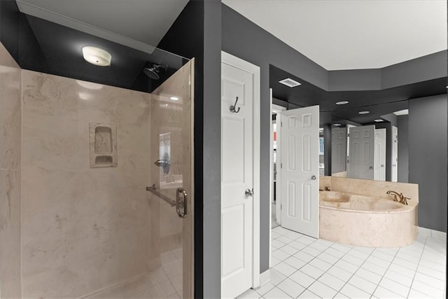 bathroom with tile patterned floors and separate shower and tub