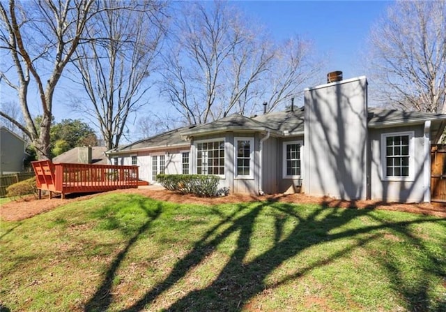 215 Truehedge Trce, Roswell, GA 30076 - back of house featuring a chimney, a deck, and board and batten siding