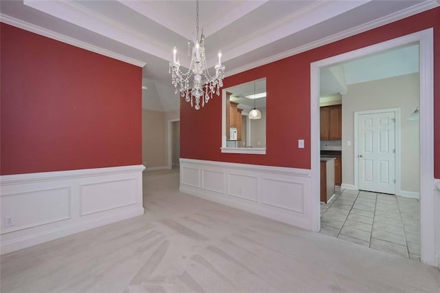 1239 Brentwood Ct, Douglasville, GA 30135 - empty room with a chandelier, light carpet, wainscoting, and ornamental molding