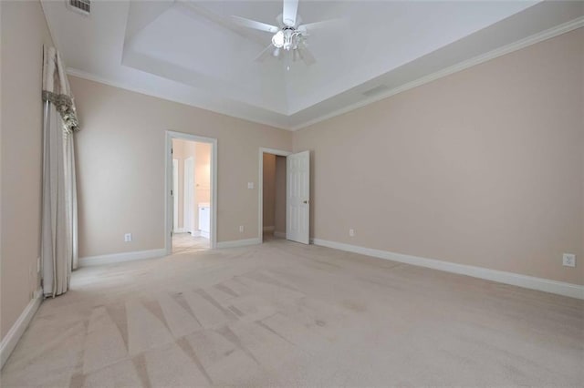 1239 Brentwood Ct, Douglasville, GA 30135 - unfurnished bedroom with a tray ceiling, light colored carpet, crown molding, and a ceiling fan
