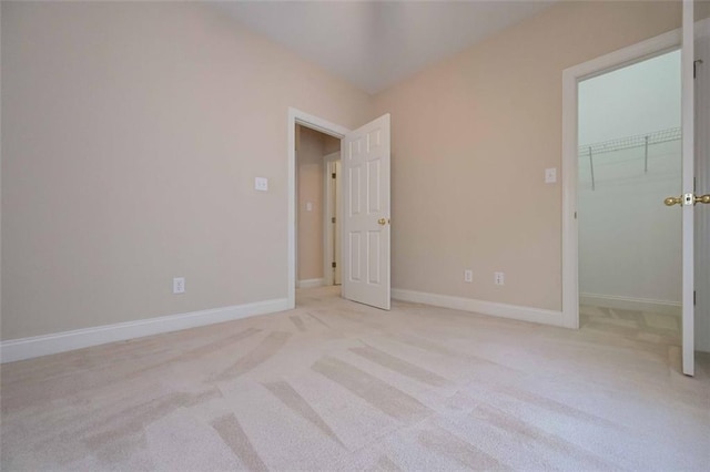 1239 Brentwood Ct, Douglasville, GA 30135 - unfurnished bedroom featuring a spacious closet, carpet, and a closet