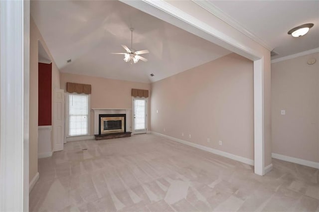 1239 Brentwood Ct, Douglasville, GA 30135 - unfurnished living room featuring ceiling fan, light colored carpet, vaulted ceiling, a glass covered fireplace, and crown molding