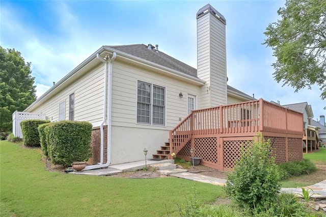1239 Brentwood Ct, Douglasville, GA 30135 - back of property with a chimney, a lawn, a deck, and stairway