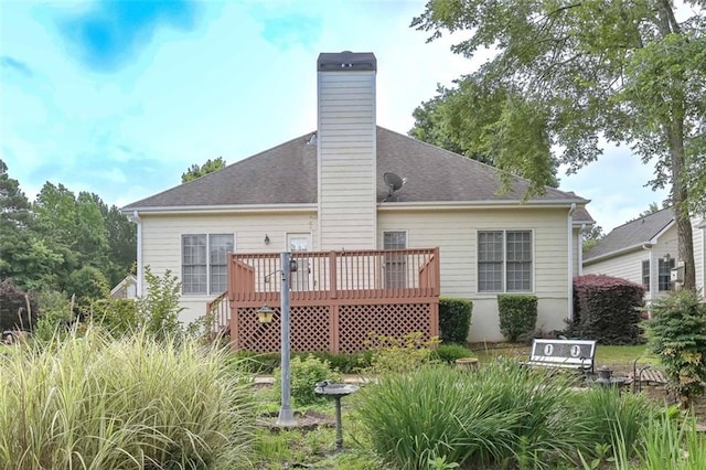 1239 Brentwood Ct, Douglasville, GA 30135 - back of house featuring a wooden deck, a chimney, and a shingled roof