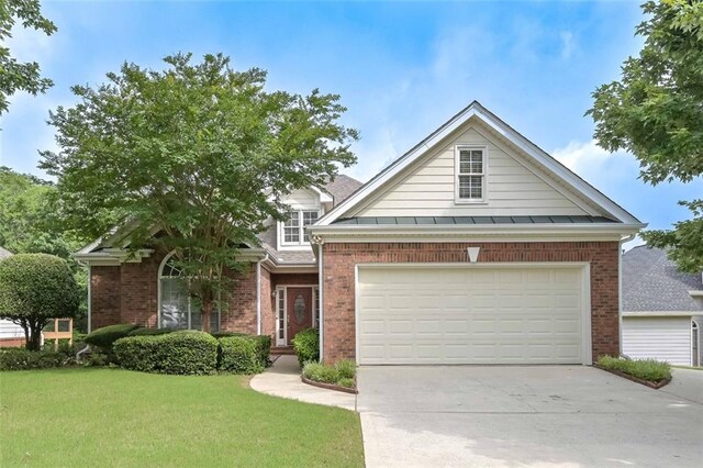 1239 Brentwood Ct, Douglasville, GA 30135 - view of front of home with brick siding, a front lawn, and driveway