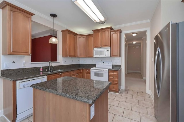 1239 Brentwood Ct, Douglasville, GA 30135 - kitchen with white appliances, decorative backsplash, a center island, pendant lighting, and dark stone countertops