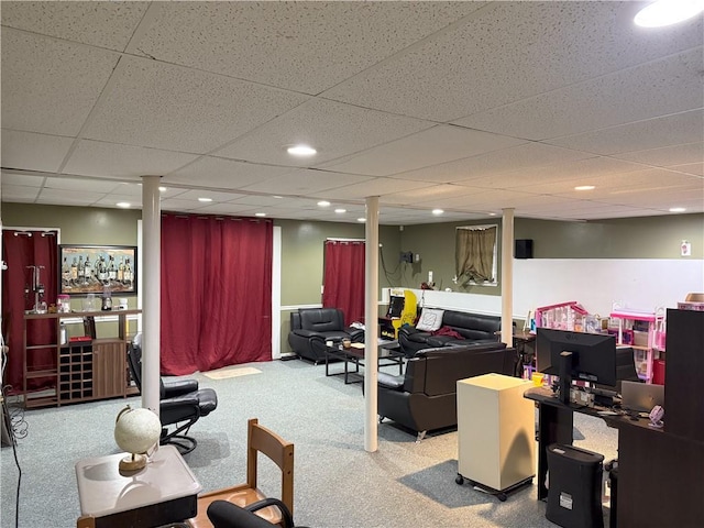 living room with carpet and a drop ceiling