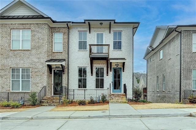 multi unit property featuring a balcony