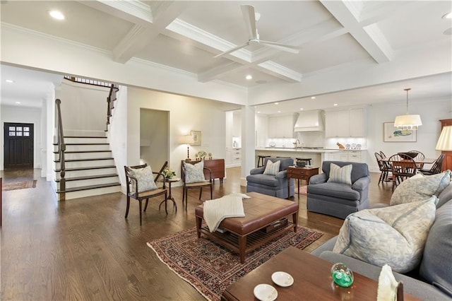 living room featuring stairway, coffered ceiling, dark wood finished floors, and beam ceiling