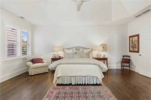 bedroom with visible vents, wood finished floors, and ornamental molding