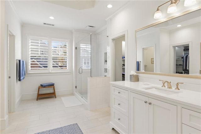 bathroom with recessed lighting, visible vents, a spacious closet, a stall shower, and vanity