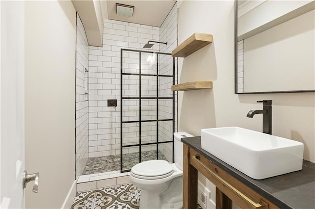 full bathroom with tile patterned flooring, vanity, toilet, and walk in shower