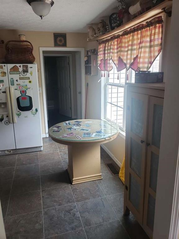 1383 Sims Rd, Winder, GA 30680 - dining space with a textured ceiling