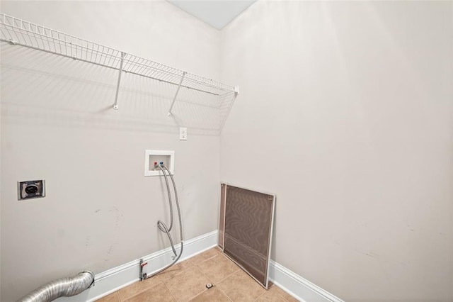 clothes washing area with washer hookup, hookup for an electric dryer, and light tile patterned floors