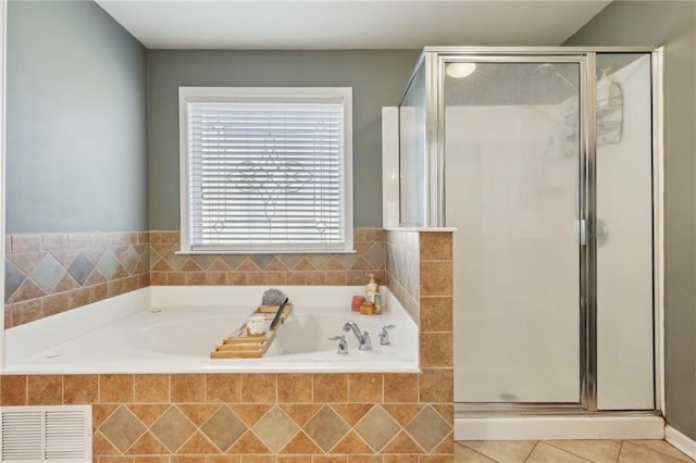 full bathroom with a bath, a stall shower, tile patterned flooring, and visible vents