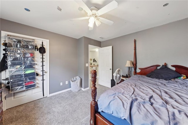 carpeted bedroom with baseboards and a ceiling fan