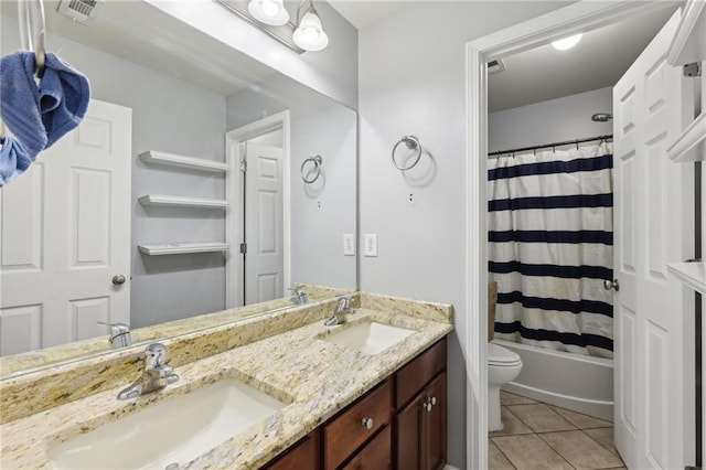 full bath featuring tile patterned flooring, visible vents, a sink, and toilet